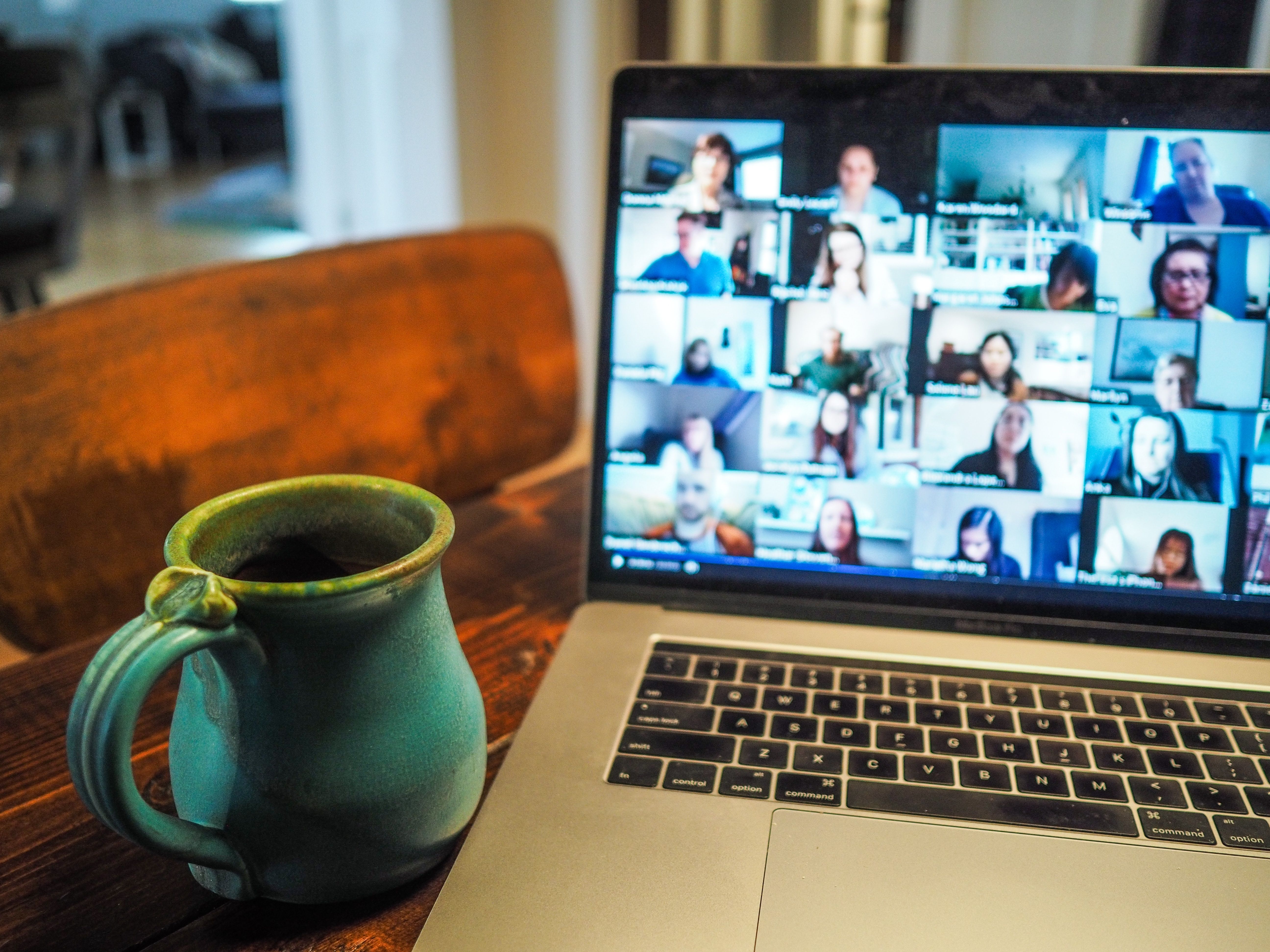 An image of a computer monitor with many faces showing on a Zoom call